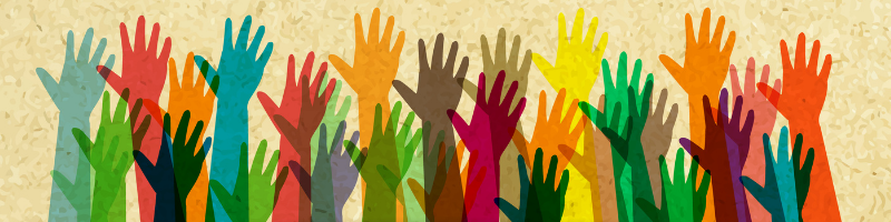 Raised hands in all colors of the rainbow, celebrating diversity and inclusion